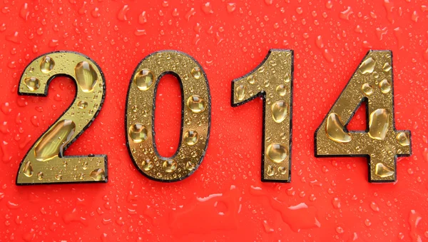 2014 in golden numbers, on red background — Stock Photo, Image