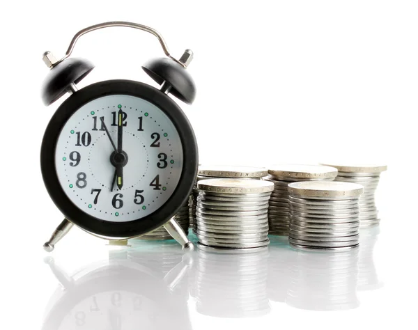 Reloj despertador con monedas aisladas en blanco —  Fotos de Stock