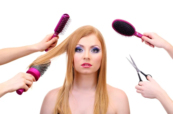 Beautiful woman and hands with brushes, scissors and hairdryer isolated on white — Stock Photo, Image