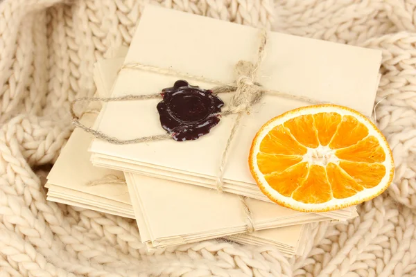 Stacks of old letters on soft scarf — Stock Photo, Image