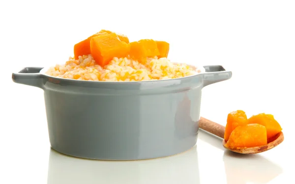 Taste rice porridge with pumpkin in saucepan, isolated on white — Stock Photo, Image