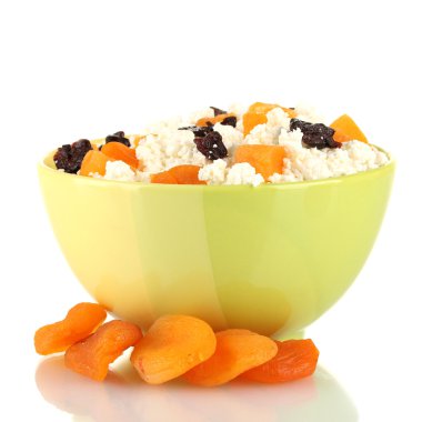 Cottage cheese in color bowl with fruits, isolated on white