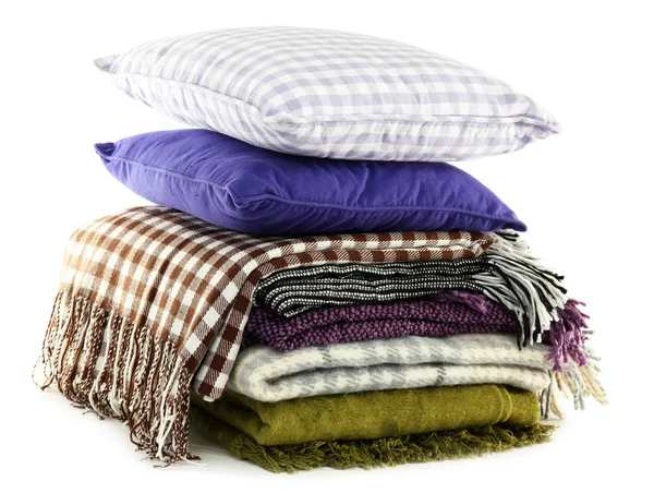 Warm plaids and colorful pillows isolated on white — Stock Photo, Image