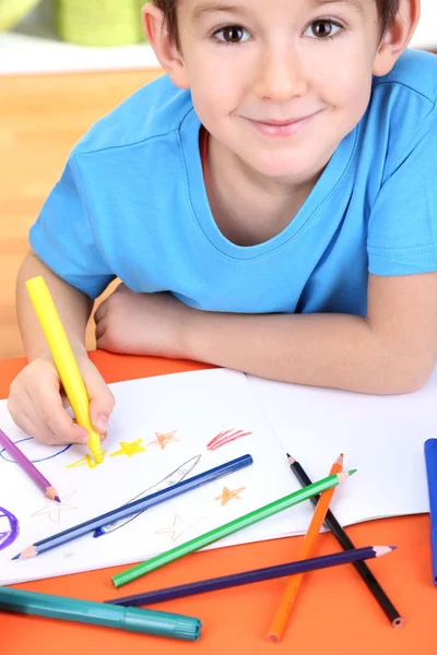 Cute little boy drawing in his album — Stock Photo, Image