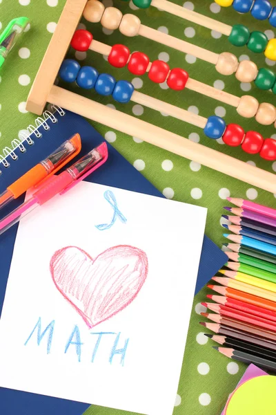 Toy abacus, notebook, pencils on bright background — Stock Photo, Image