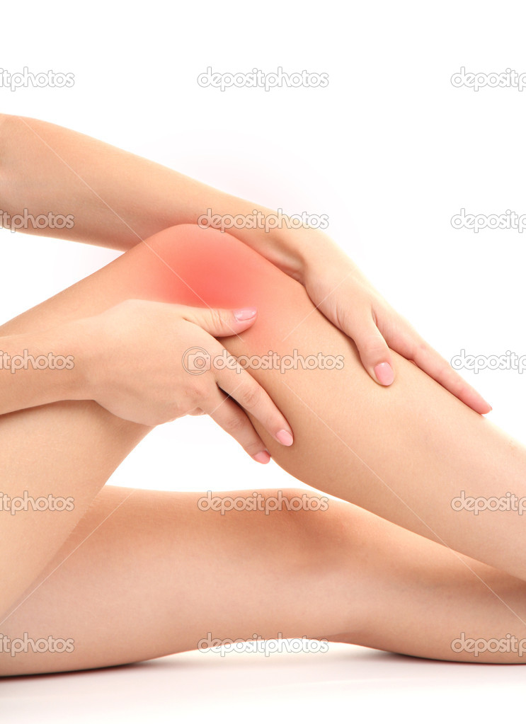 woman holding sore knee, isolated on white