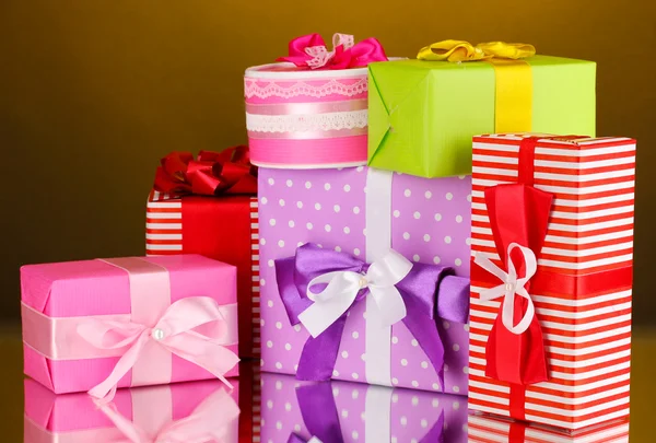 Colorful gifts on orange background — Stock Photo, Image