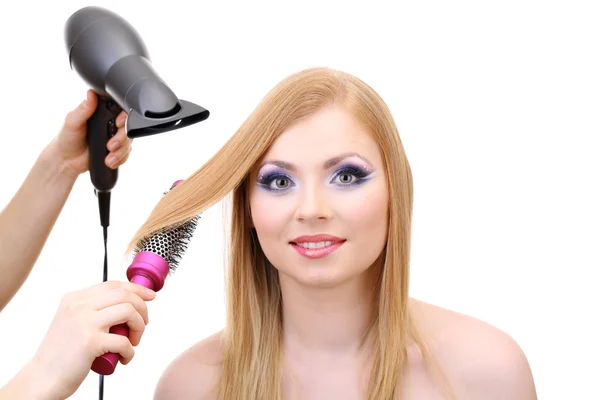 Belle femme et les mains avec sèche-cheveux, isolé sur blanc — Photo