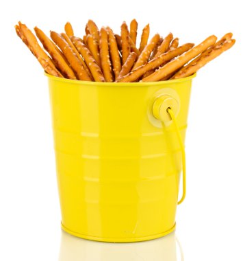 Tasty crispy sticks in yellow pail isolated on white