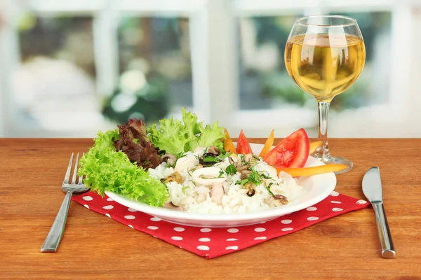 Delicatessen seafood salad with rice in glass on bright background — Stock Photo, Image