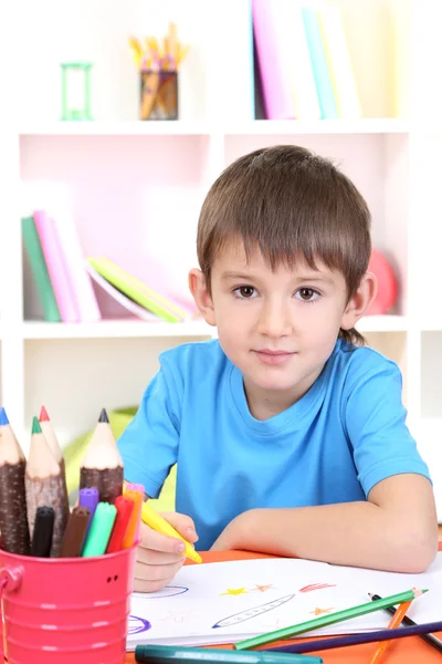 Cute little boy drawing in his album — Stock Photo, Image