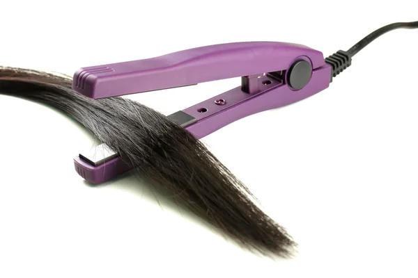 Hair straighteners and hair, isolated on white — Stock Photo, Image