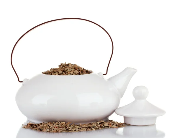 Gedroogde kruiden in theepot, geïsoleerd op wit. conceptuele foto van kruiden thee. — Stockfoto