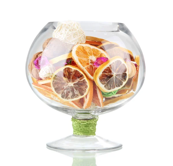 Dried oranges, wicker balls and other home decorations in glass bowl, isolated on white — Stock Photo, Image