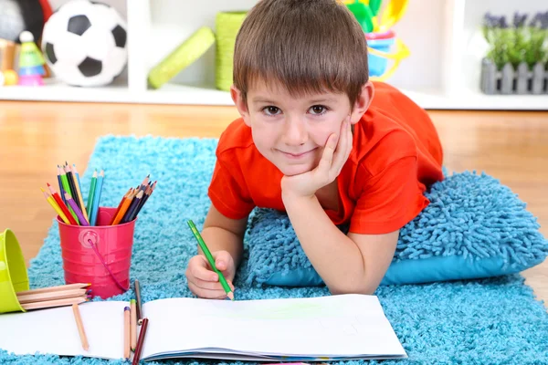 Cute little boy drawing in his album — Stock Photo, Image