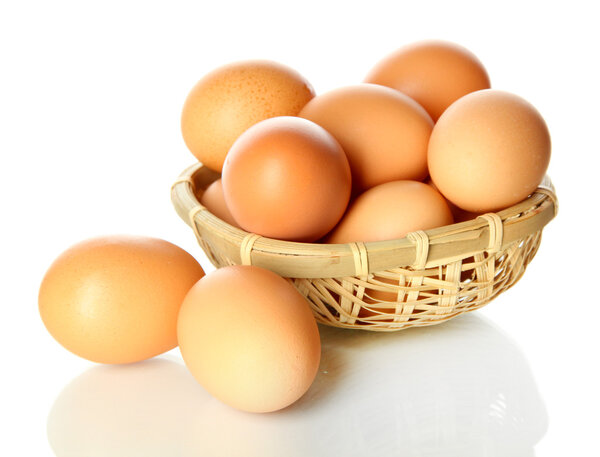 Many eggs in basket isolated on white