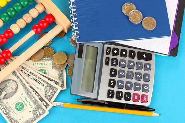 Bright wooden abacus and calculator. Conceptual photo of old and modern business — Stock Photo, Image