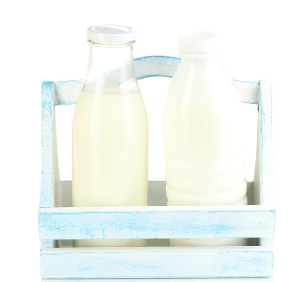 Milk in bottles in wooden box isolated on white — Stock Photo, Image