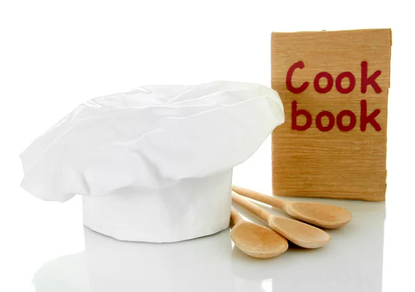 Sombrero de chef con cucharas y libro de cocina aislado en blanco —  Fotos de Stock