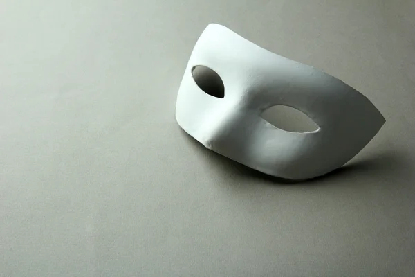 White mask, on grey background — Stock Photo, Image