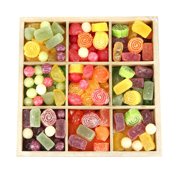 Multicolor candies in wooden box, isolated on white — Stock Photo, Image