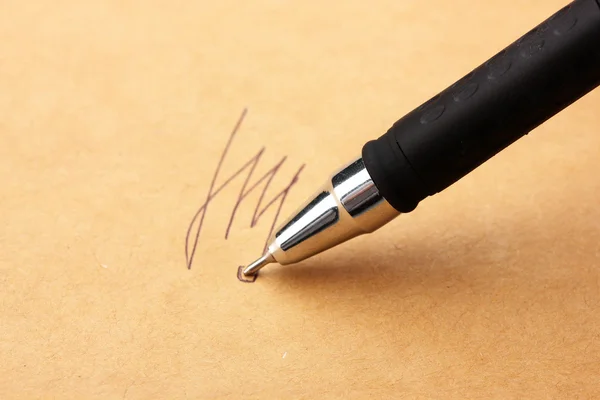 Closeup of signature (fake, not real) and pen, on old paper — Stock Photo, Image