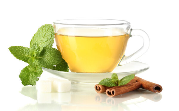 Cup of tea with mint and cinnamon isolated on white