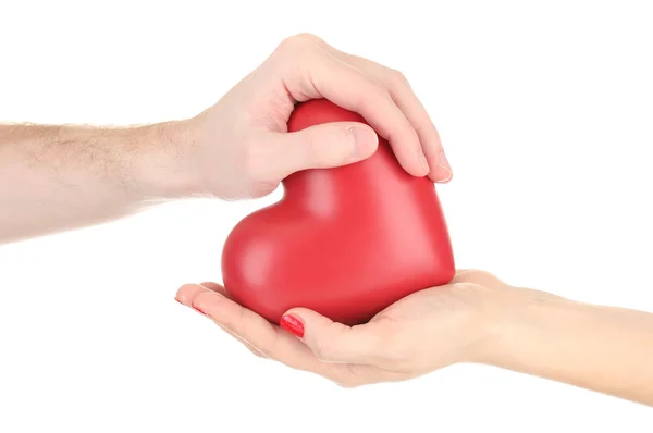 Red heart in woman and man hands, isolated on white — Stock Photo, Image