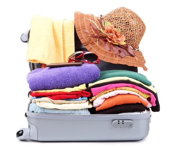 Open silver suitcase with clothing isolated on white — Stock Photo, Image