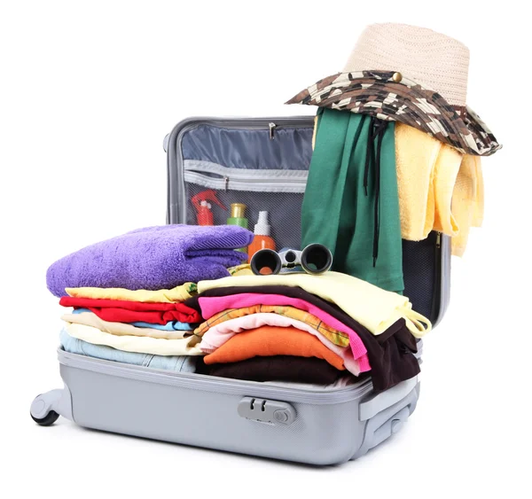 Open silver suitcase with clothing isolated on white — Stock Photo, Image