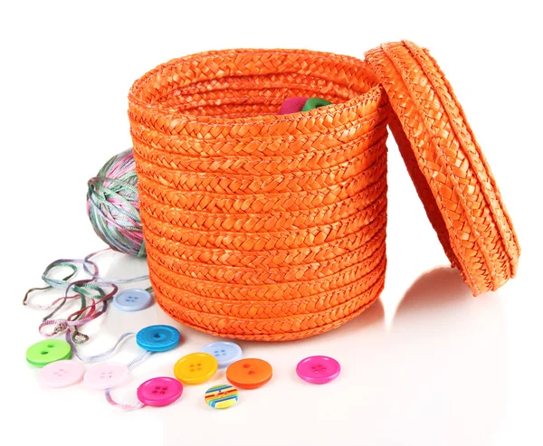 Orange wicker basket with accessories for needlework isolated on white — Stock Photo, Image