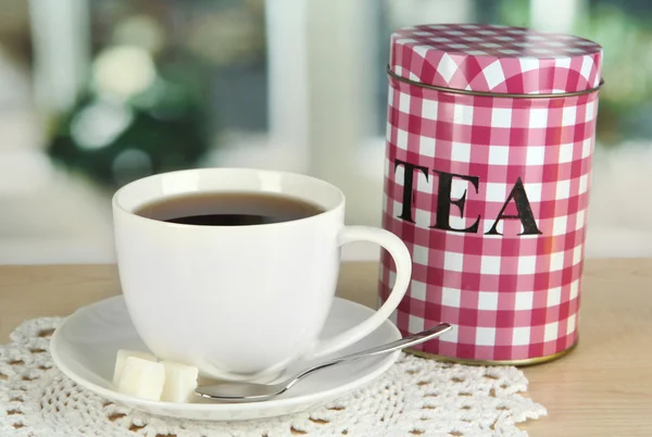 Jar and cup of tea isolated on white — Stock Photo, Image