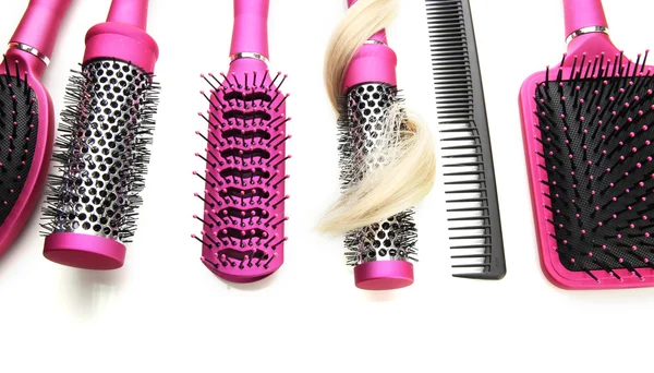 Comb brushes with hair, isolated on white — Stock Photo, Image