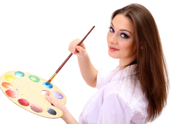 Beautiful young woman painter with brushes and palette, isolated on white — Stock Photo, Image