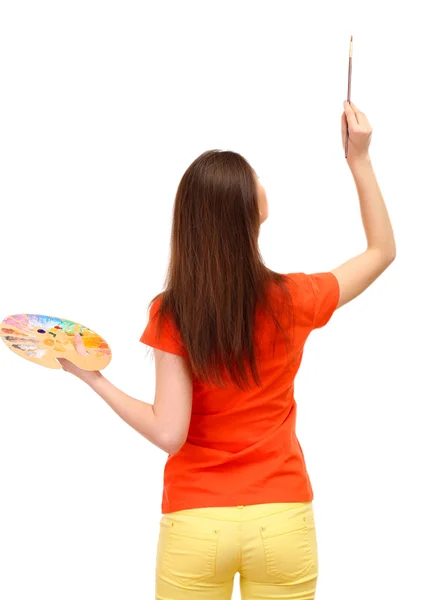 Beautiful young woman painter with brushes and palette, isolated on white — Stock Photo, Image