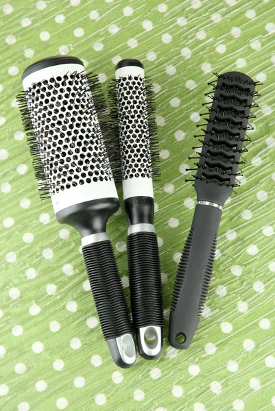 Black combs on color background — Stock Photo, Image