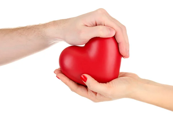 Cuore rosso nelle mani della donna e dell'uomo, isolato su bianco — Foto Stock