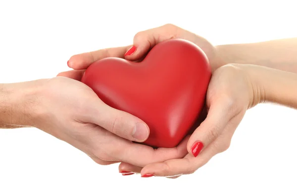 Red heart in woman and man hands, isolated on white — Stock Photo, Image