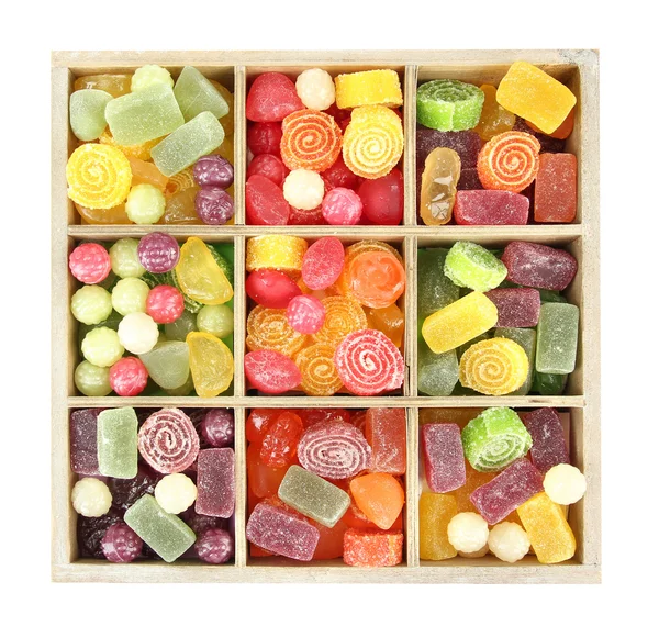 Multicolor candies in wooden box, isolated on white — Stock Photo, Image