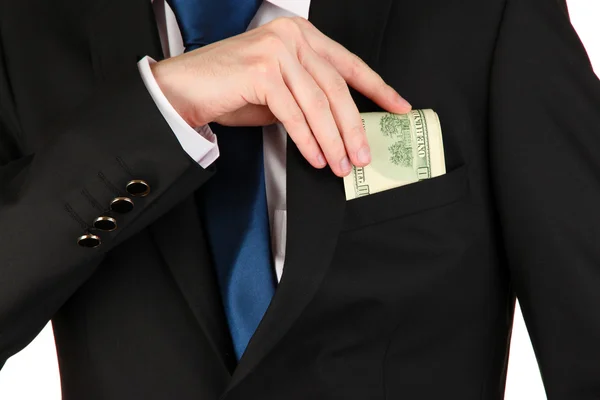 Homem de negócios escondendo dinheiro no bolso isolado em branco — Fotografia de Stock