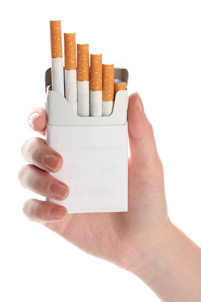 Woman hand with box of cigarettes, isolated on a white