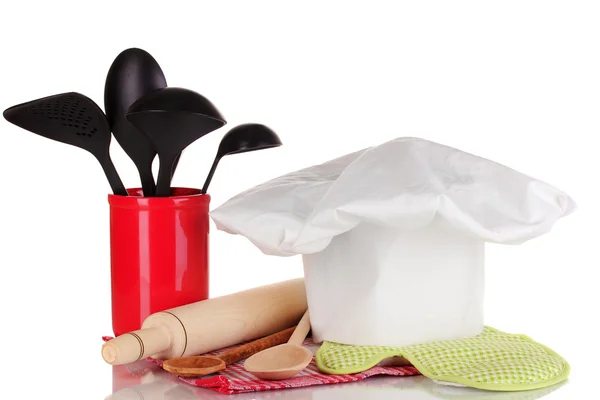 Chef's hat with spoons and battledore isolated on white — Stock Photo, Image