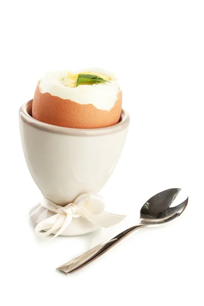 Boiled egg in egg cup, isolated on white — Stock Photo, Image