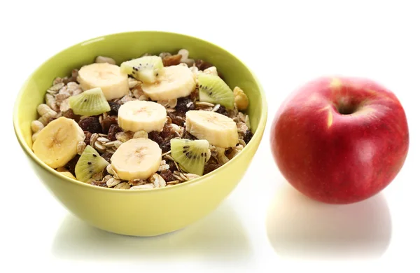 Leckeres und gesundes Müsli in Schüssel mit Apfel isoliert auf weiß — Stockfoto