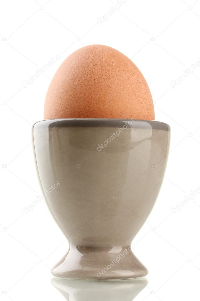 Whole boiled egg in egg cup, isolated on white Stock Photo by