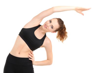 Beyazlar üzerinde izole edilmiş spor yapan genç bir kadın.