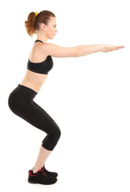 Beyazlar üzerinde izole edilmiş spor yapan genç bir kadın.