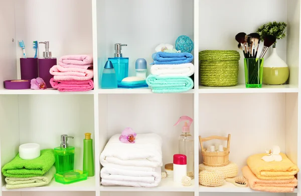 Bath accessories on shelfs in bathroom — Stock Photo, Image