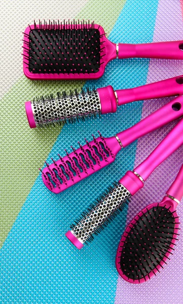 Comb brushes on bright background — Zdjęcie stockowe