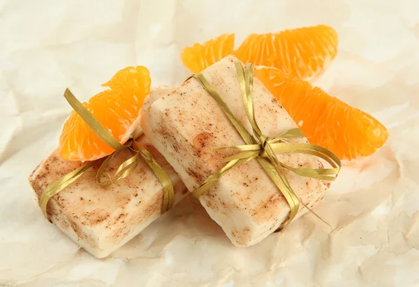 Natural handmade soap and orange, on beige background — Stock Photo, Image